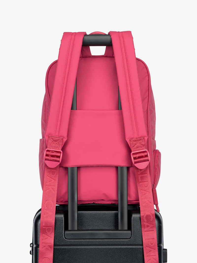 CALPAK water resistant Luka Laptop Backpack with adjustable shoulder straps and trolley sleeve in dragonfruit