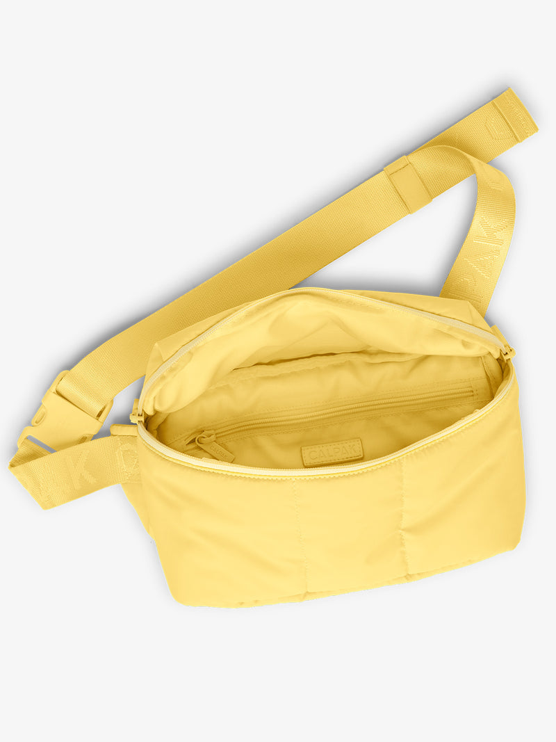 CALPAK Luka Belt Bag close up interior and strap in yellow