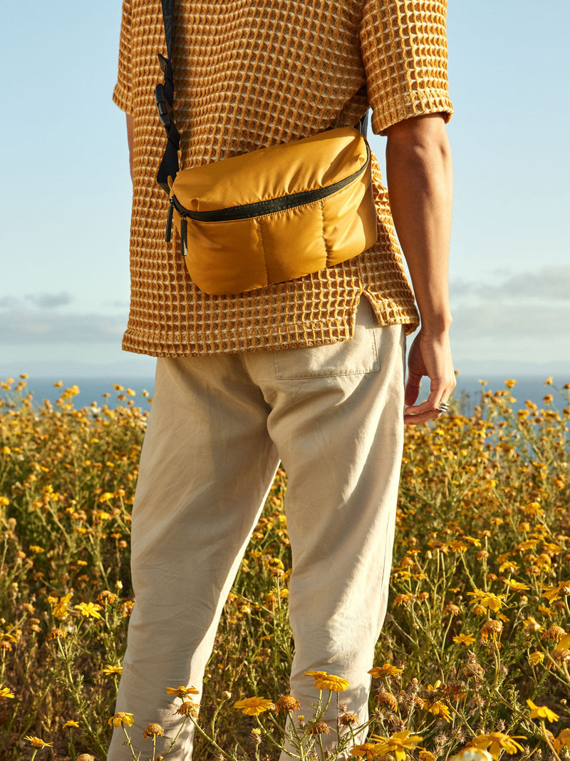 CALPAK Luka belt bag in yellow dijon color