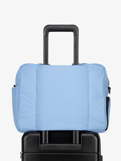 CALPAK Luka Weekender Duffel Bag with trolley sleeve for travel in winter sky