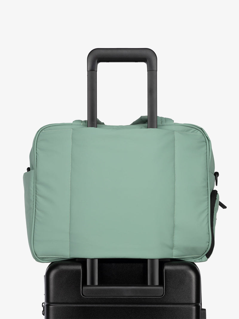 CALPAK Luka Weekender Duffel Bag with trolley sleeve for travel in green