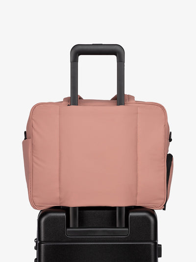 CALPAK Luka Duffel bag with luggage trolley sleeve in peony