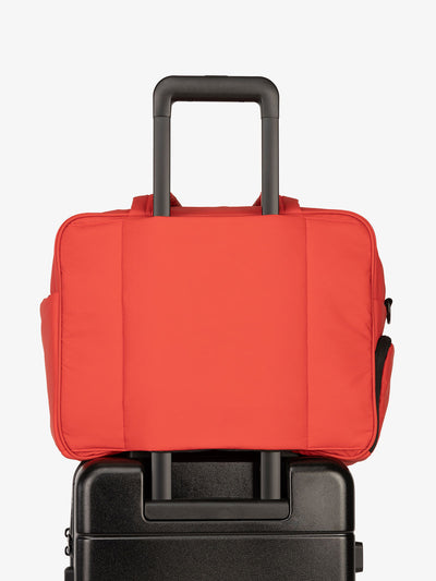 CALPAK Luka Duffel bag with luggage trolley sleeve in rouge