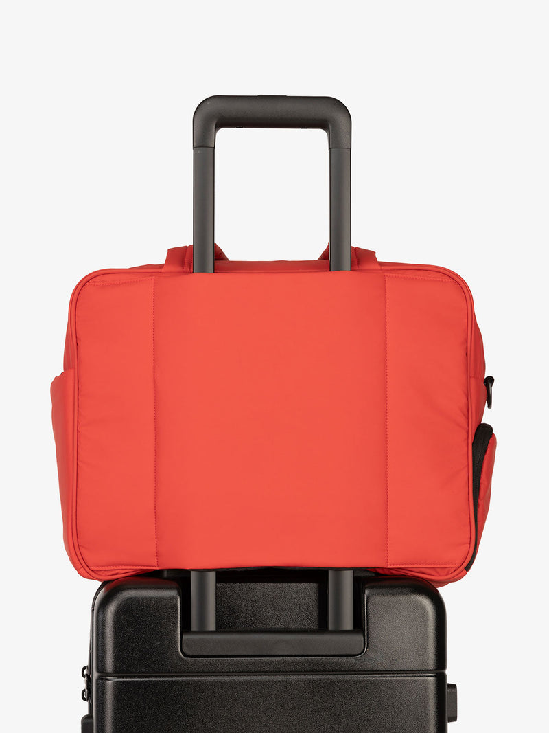 CALPAK Luka Duffel bag with luggage trolley sleeve in rouge