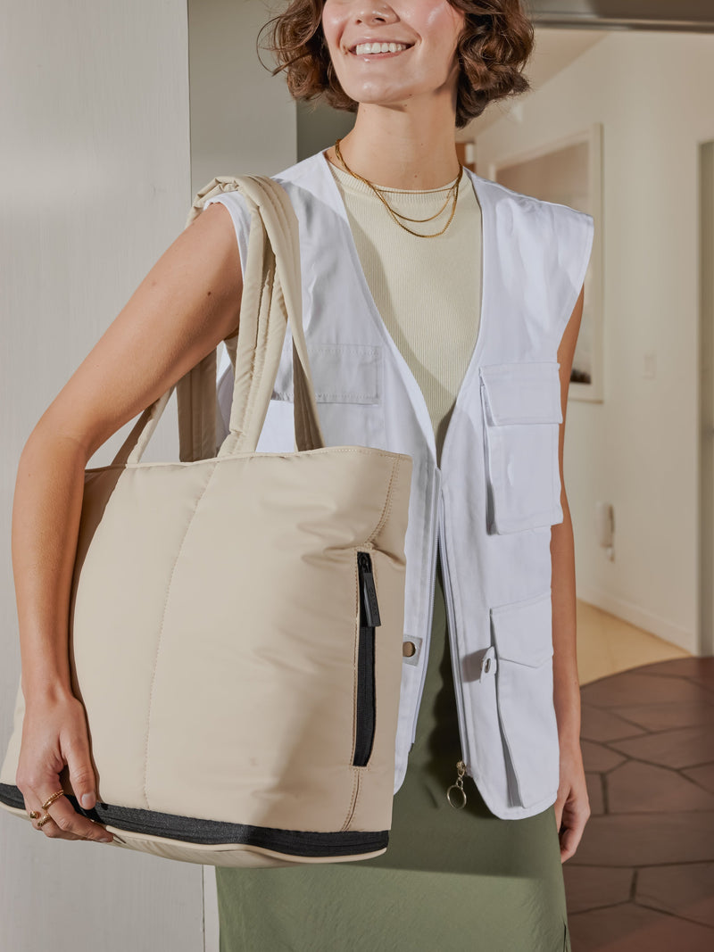 CALPAK Luka expandable bag with zippered pockets and laptop compartment in ivory; ALT2201-OATMEAL 