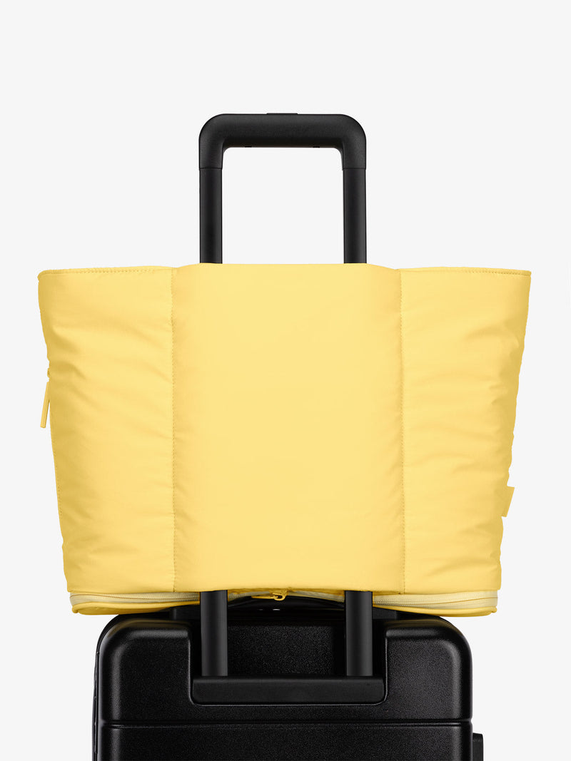 CALPAK Luka expandable travel bag with laptop compartment and trolley sleeve in yellow