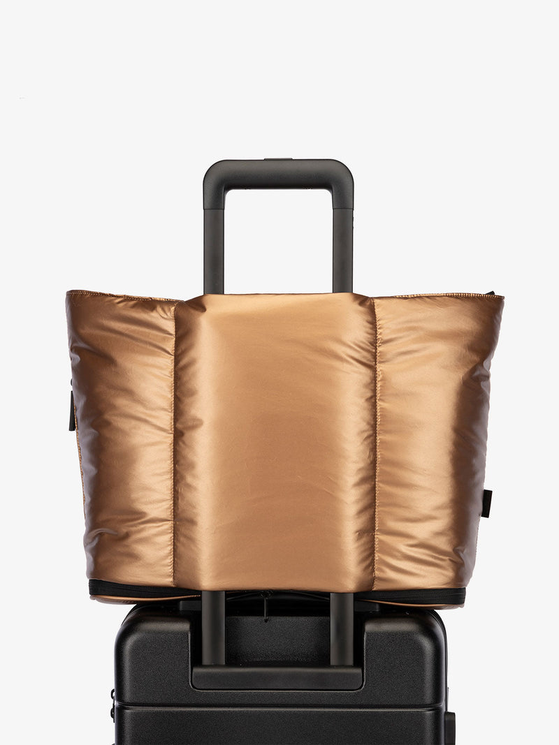 CALPAK Luka expandable travel bag with laptop compartment and trolley sleeve in metallic copper