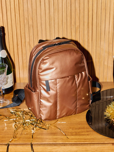 CALPAK Luka Mini Backpack with soft puffy exterior and front zippered pocket in metallic copper; BPM2201-COPPER view 2