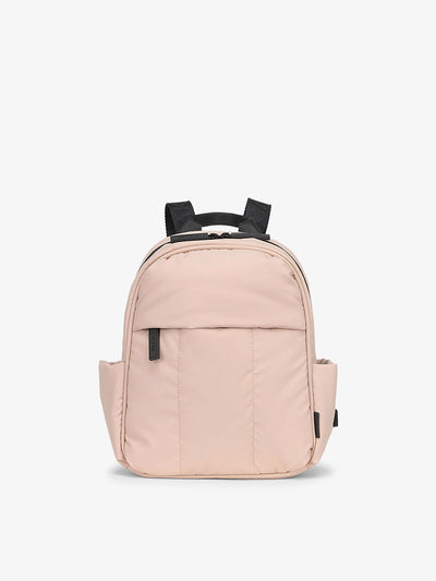 CALPAK Luka Mini travel Backpack with soft puffy exterior and front pocket in pink; BPM2201-ROSE-QUARTZ view 1