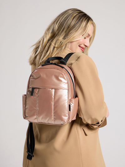 CALPAK Luka Mini Backpack with soft puffy exterior and front zippered pocket in metallic pink; BPM2201-ROSE-GOLD view 2