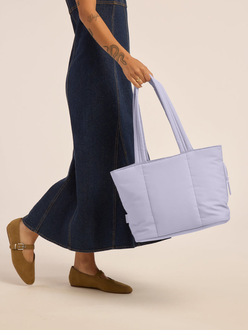 Model holding the CALPAK Luka Mini Tote in purple lavender in Orchid