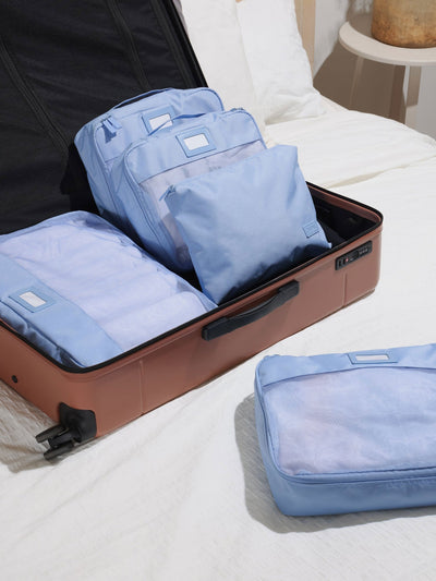 CALPAK 5 piece set packing cubes for travel with labels and top handles in sky; PC1601-SKY view 2