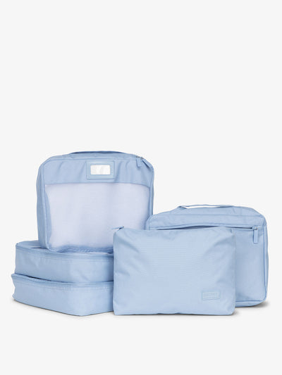 CALPAK 5 piece set packing cubes for travel with labels and top handles in sky; PC1601-SKY view 1