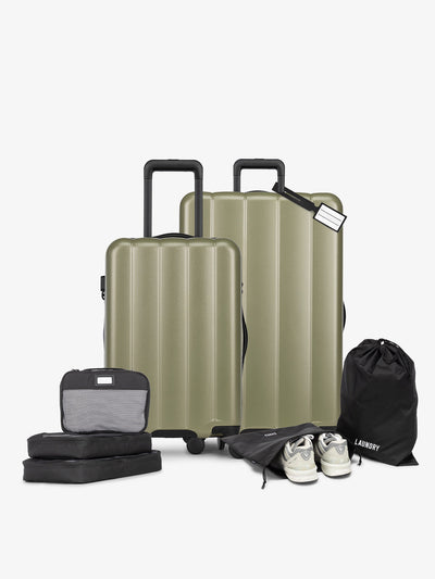 CALPAK Starter Luggage Set with Carry-On, Large Luggage, Packing Cubes, Pouches and Luggage tag in green; LCO8000-PISTACHIO view 1