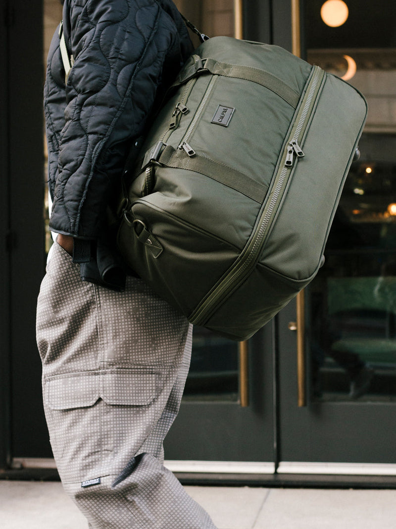 moss green CALPAK stevyn duffel bag