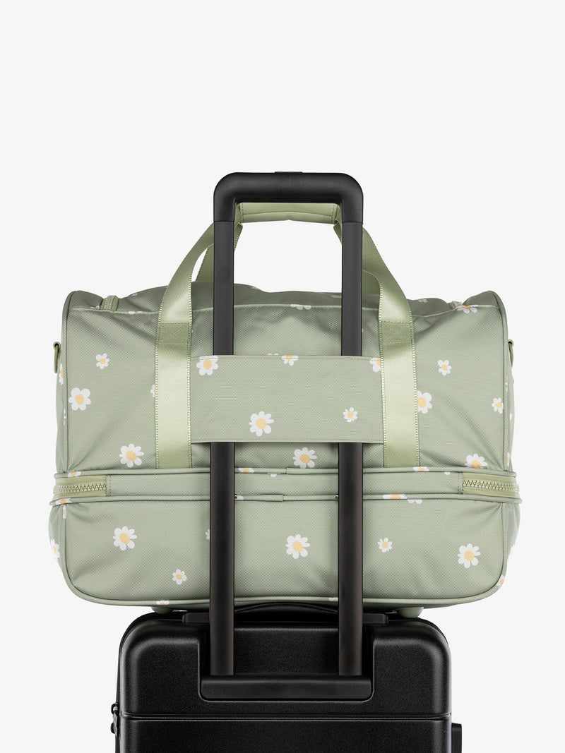 CALPAK Stevyn Duffel bag with trolley sleeve in green floral print