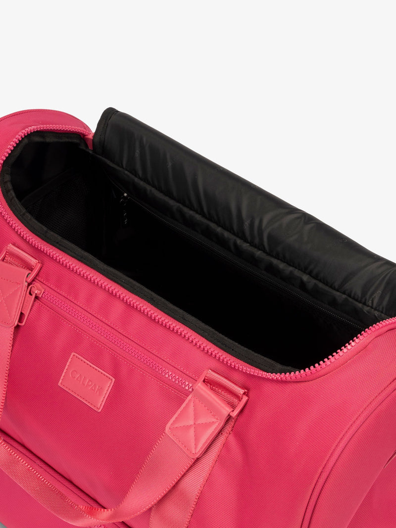 CALPAK Stevyn Duffel with multiple interior pockets in dragonfruit