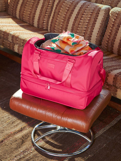 CALPAK Stevyn Duffel bag with removable crossbody strap in pink dragonfruit; DST7019-DRAGONFRUIT