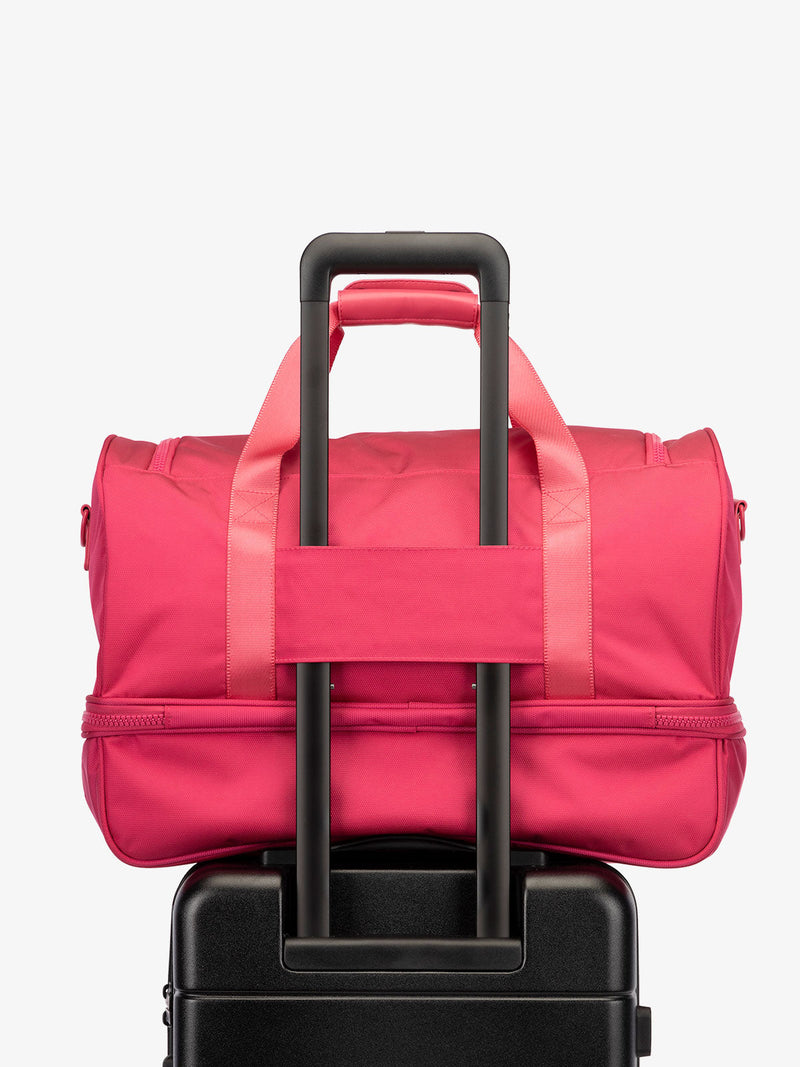 CALPAK Stevyn Duffel with trolley sleeve in hot pink