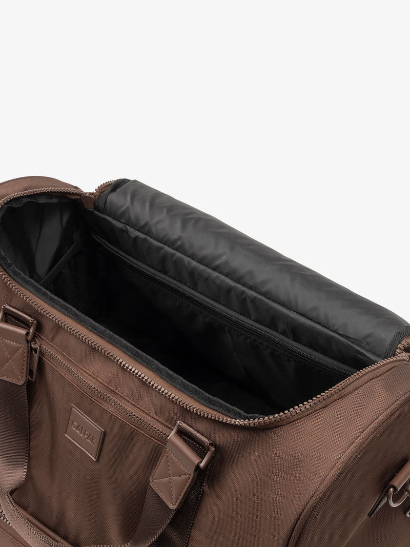 CALPAK Stevyn Duffel with multiple interior pockets in brown