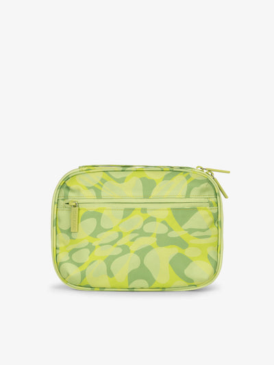 Back-view of CALPAK tech organizer featuring zippered pouch in abstract green print