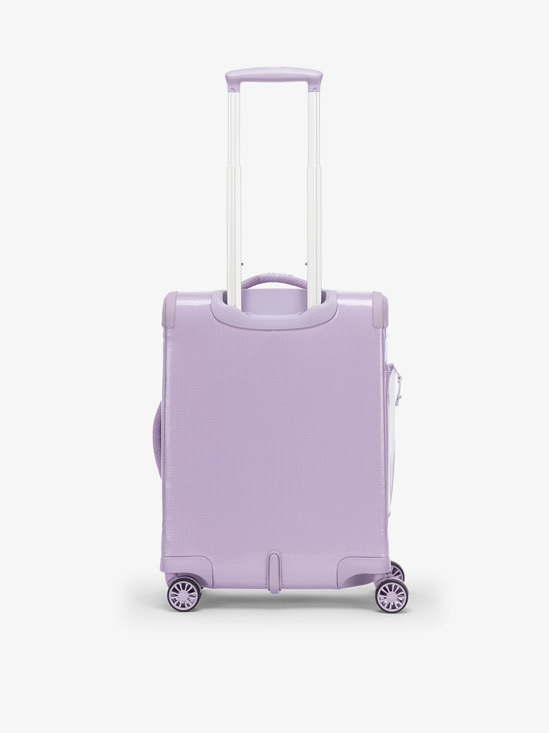 Studio product shot of back-facing CALPAK Terra 35L Carry-On luggage with soft shell and 360 spinner wheels in amethyst purple