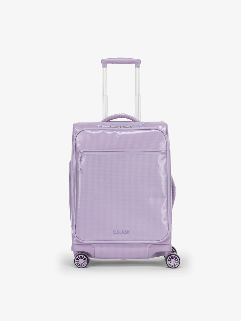 Studio product shot of front-facing CALPAK Terra 35L Carry-On luggage with soft shell and 360 spinner wheels in amethyst