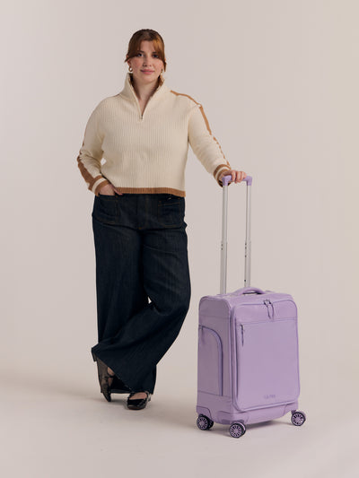 Studio product shot of front-facing CALPAK Terra 35L Carry-On luggage with soft shell and 360 spinner wheels in light purple amethyst; LTR1020-AMETHYST view 2