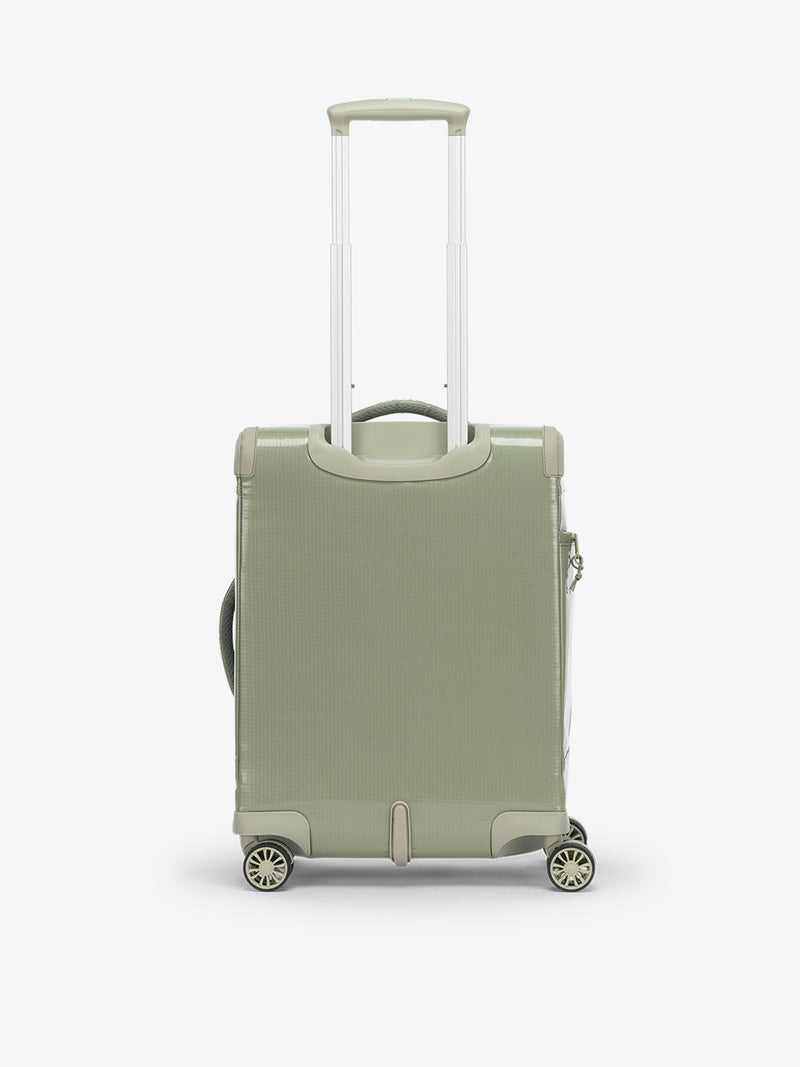 Studio product shot of front-facing CALPAK Terra 35L Carry-On luggage with soft shell and 360 spinner wheels in juniper green