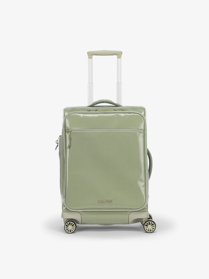 Studio product shot of back-facing CALPAK Terra 35L Carry-On luggage with soft shell and 360 spinner wheels in juniper