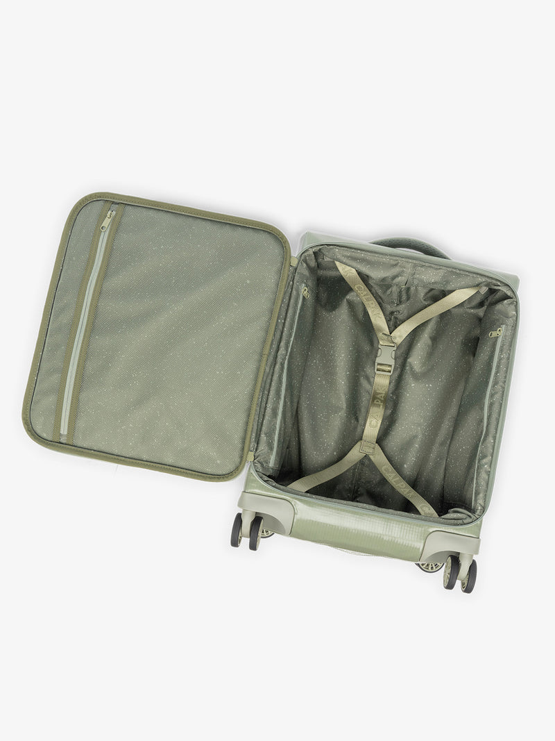 Studio product shot of interior compartment of CALPAK Terra 35L Carry-On luggage with soft shell and 360 spinner wheels in green