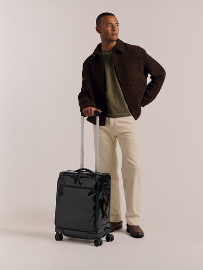 Studio product shot of front-facing CALPAK Terra 35L Carry-On luggage with soft shell and 360 spinner wheels in obsidian; LTR1020-OBSIDIAN view 2