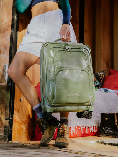 Studio product shot of front-facing CALPAK Terra Carry-On luggage with soft shell and 360 spinner wheels in juniper model; LTE1020-JUNIPER view 2