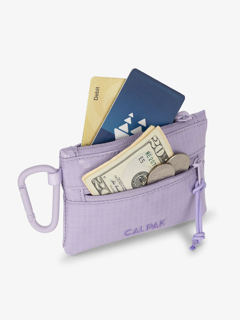 Amethyst CALPAK Terra Clippable Card Pouch with cards in main pocket and a $20 dollar bill and coins in the front pocket