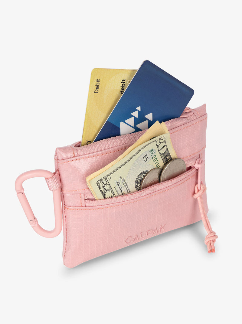 Blossom CALPAK Terra Clippable Card Pouch with cards in main pocket and a $20 dollar bill and coins in the front pocket