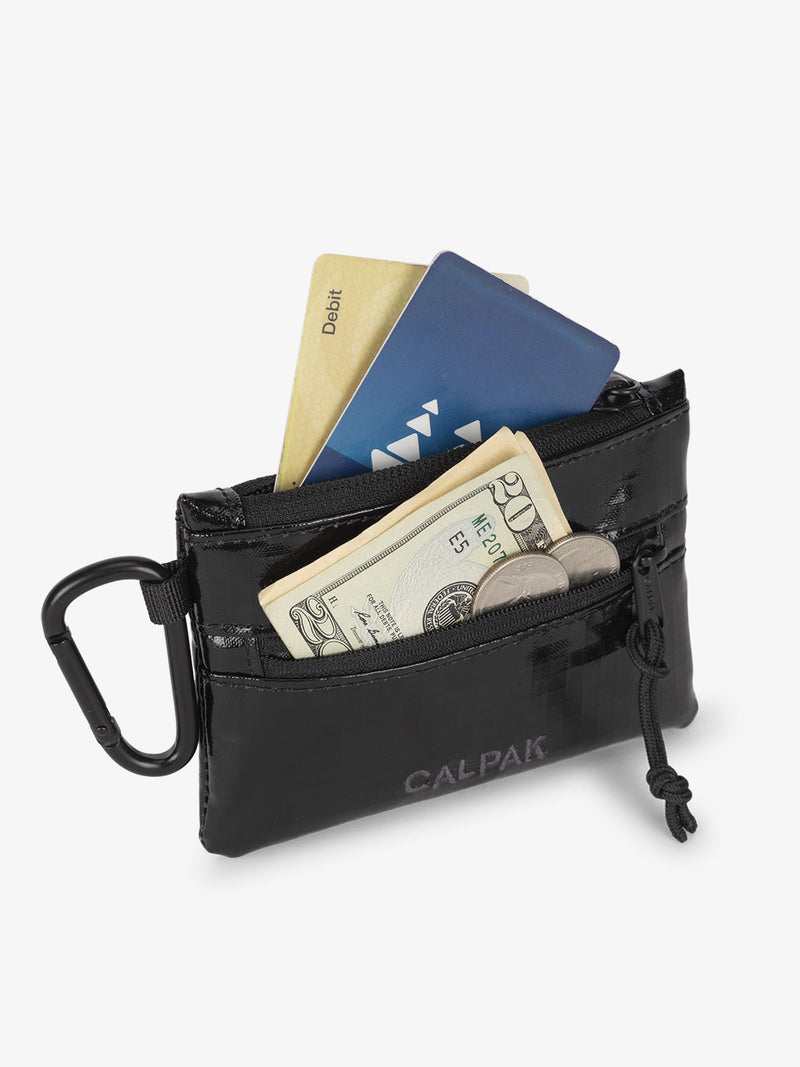 Obsidian CALPAK Terra Clippable Card Pouch with cards in main pocket and a $20 dollar bill and coins in the front pocket