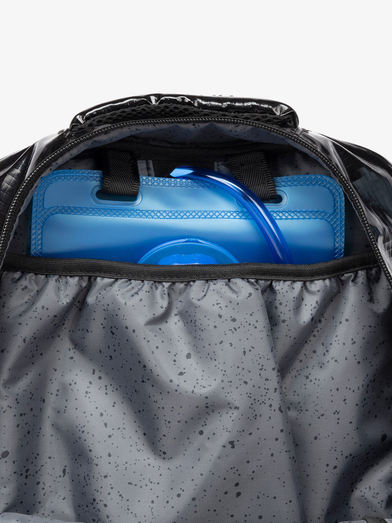 Close up of CALPAK 2L removable hydration reservoir back-slip pocket