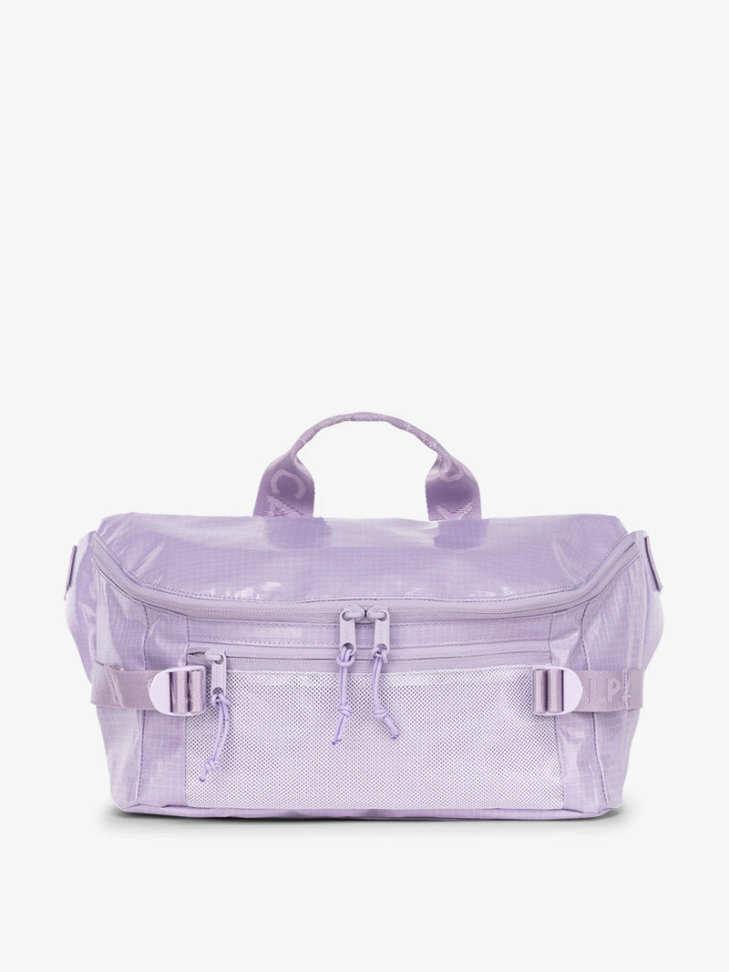 CALPAK Terra Sling Bag with mesh front pocket and top handle in amethyst