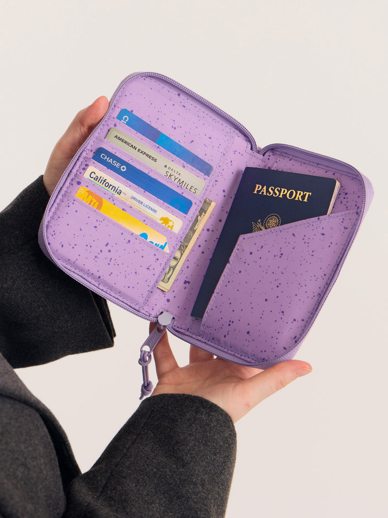 CALPAK Terra Zippered Passport Wallet in Amethyst light purple opened view with cards and passport