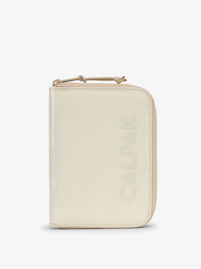 CALPAK Terra Zippered Passport Wallet in beige White Sands front view; ATPW2501-WHITE-SANDS view 1