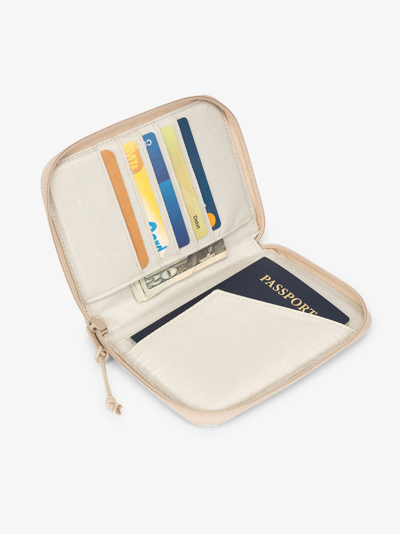 CALPAK Terra Zippered Passport Wallet beige White Sands open view with cards in card slots and passport in passport slip