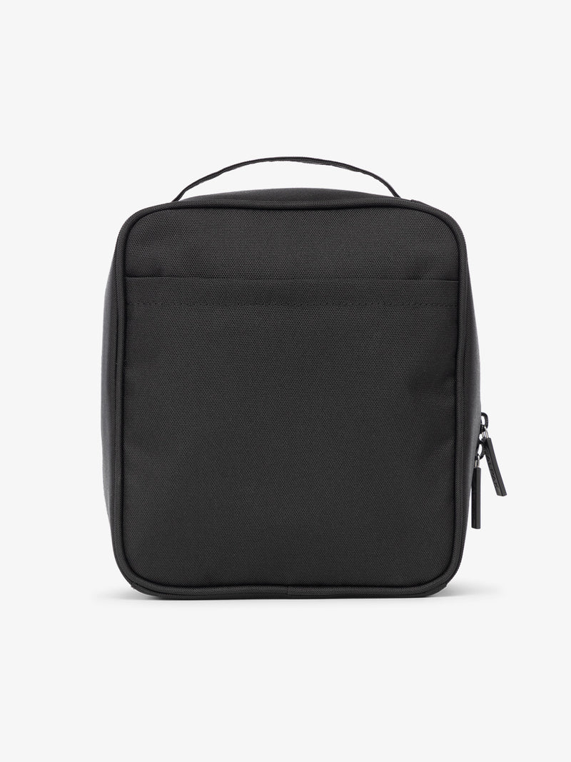 Backview of CALPAK The Everything Cube with exterior back slip pocket in black