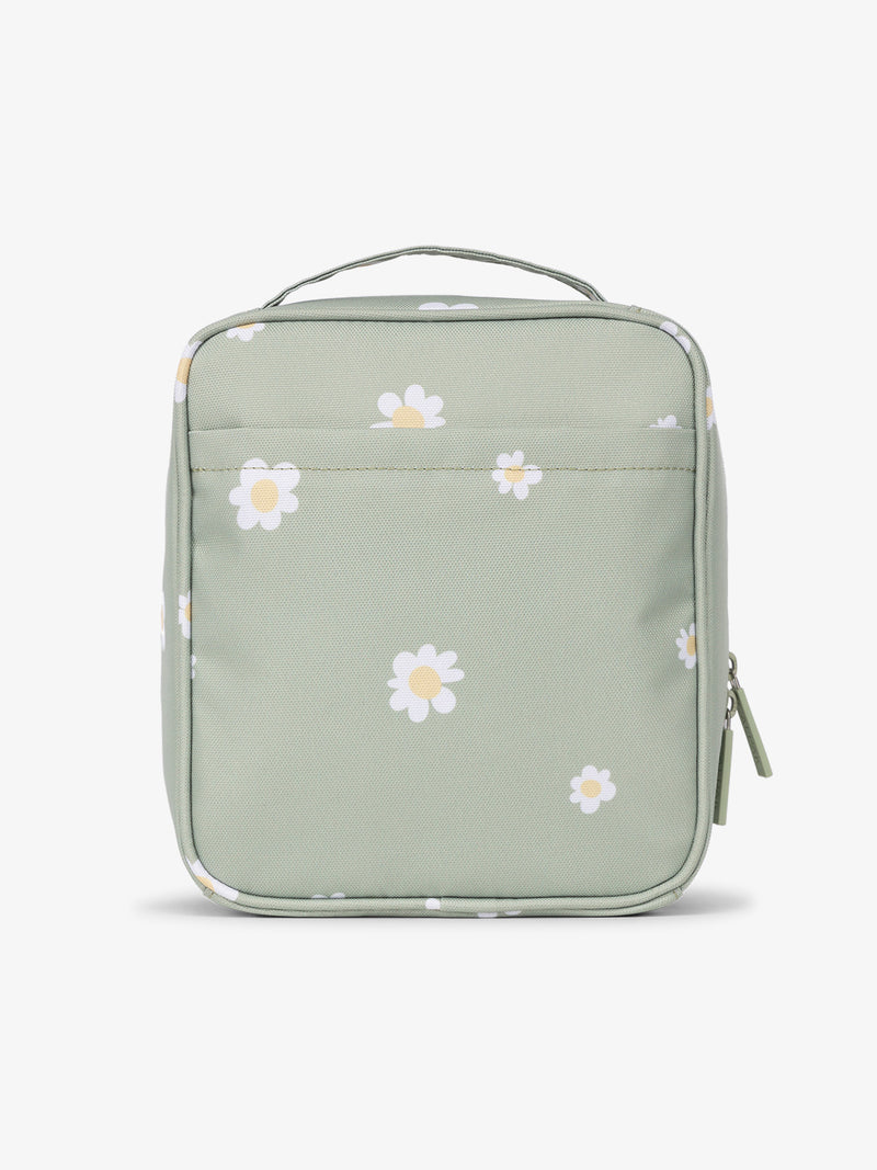 Backview of CALPAK The Everything Cube with exterior back slip pocket in green floral daisy print