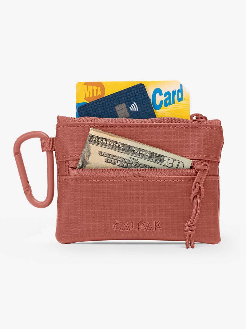 CALPAK Terra Clippable Card Pouch in red and orange Matte Clay utilized as wallet