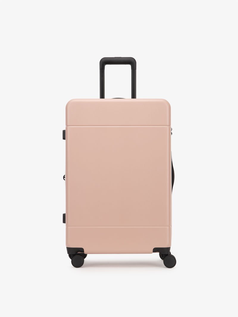 medium 26 inch hardside polycarbonate luggage in pink sand color from CALPAK Hue collection