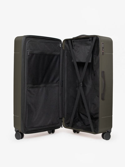 CALPAK Hue trunk suitcase in green moss color with compression straps