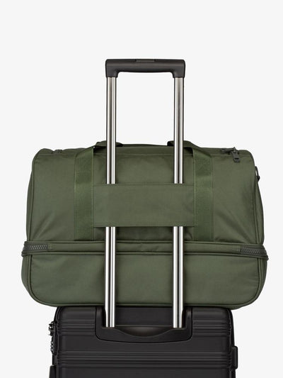green moss CALPAK Stevyn duffel bag with luggage trolley sleeve