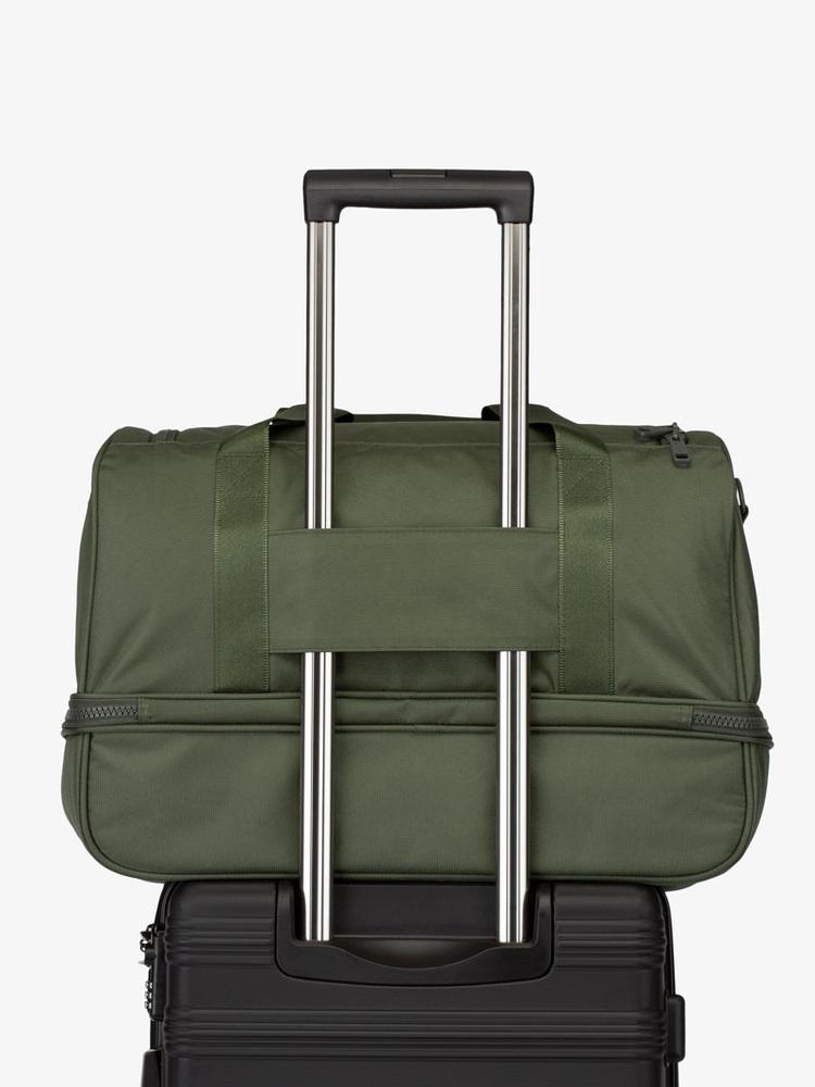 green moss CALPAK Stevyn duffel bag with luggage trolley sleeve