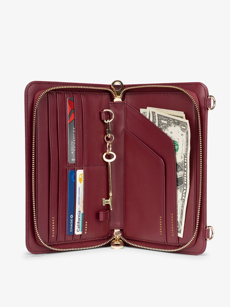 Interior of dark red RFID lined CALPAK Croc Wallet featuring multiple pockets for cards and travel documents