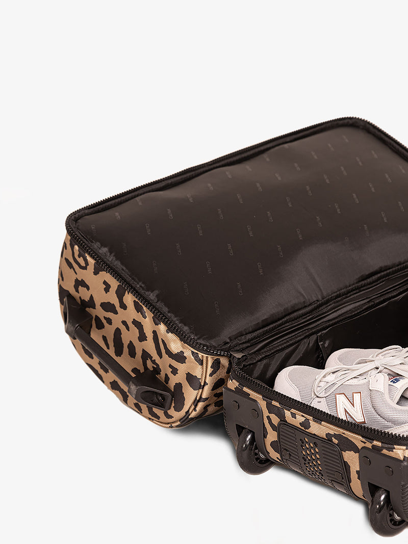 CALPAK Stevyn Rolling Duffle interior of shoe compartment in cheetah